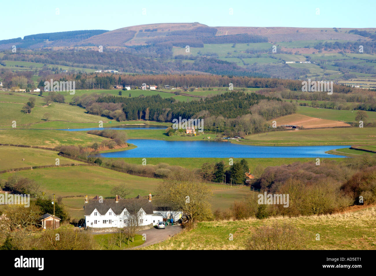 View looking toward reservoir and Twm Barlwm iron age hill fort at Newport South Wales UK Stock Photo