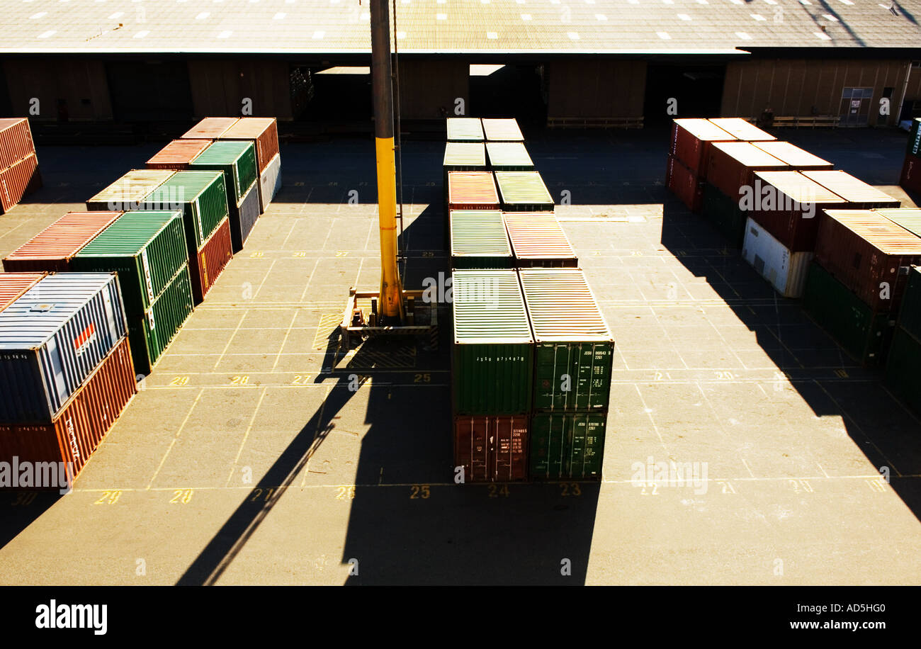Storage cargo metal shipping crates stacked in front of warehouse Stock