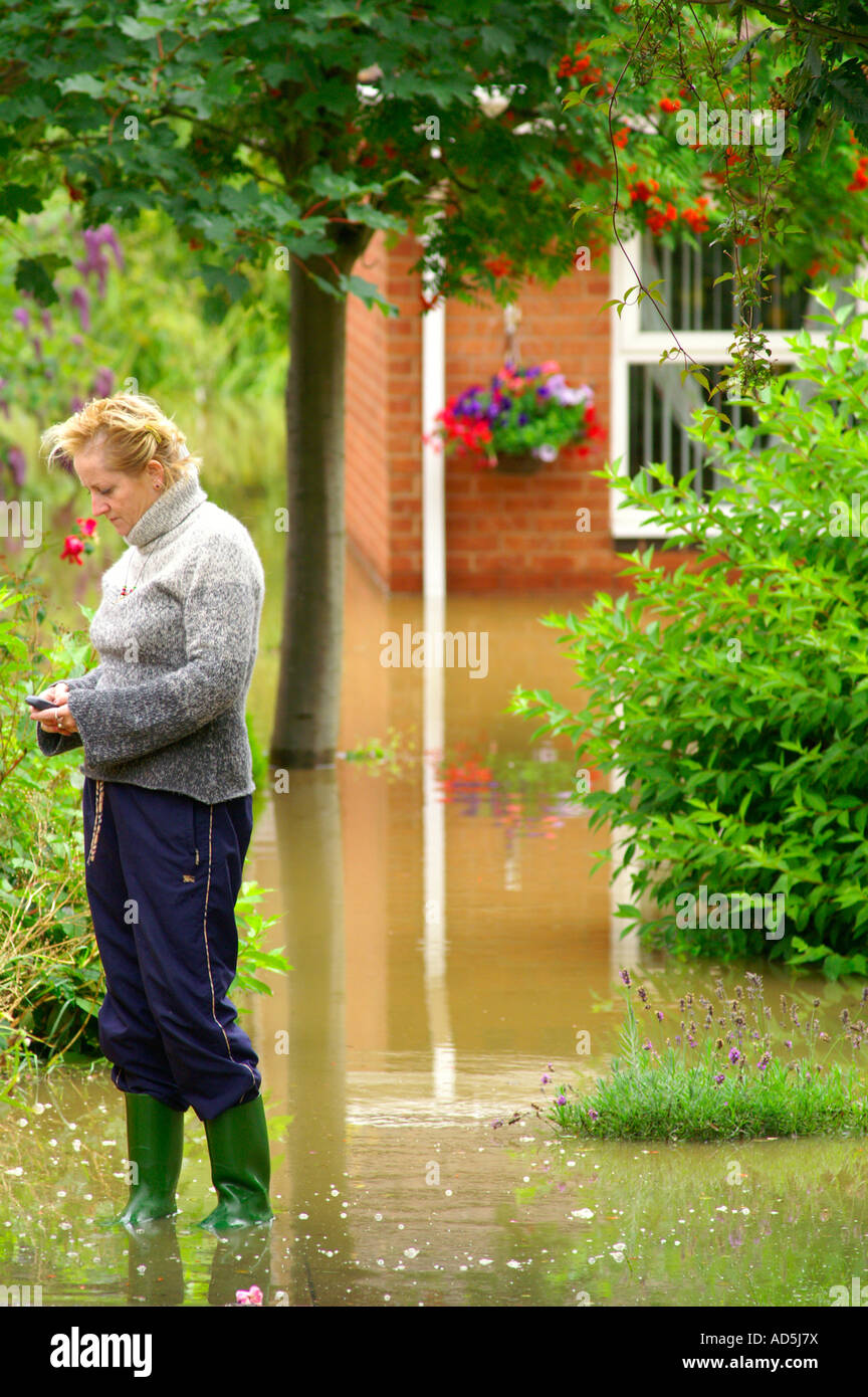 desperate woman calling to insurance company after her house have been flooded. north east England September 2008 Stock Photo