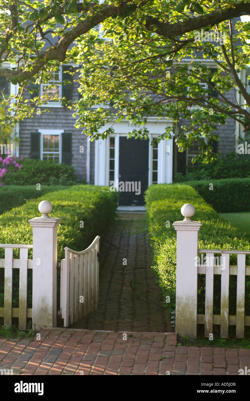 Edgartown Marthas Vineyard Home with white picket fence along ocean Stock Photo