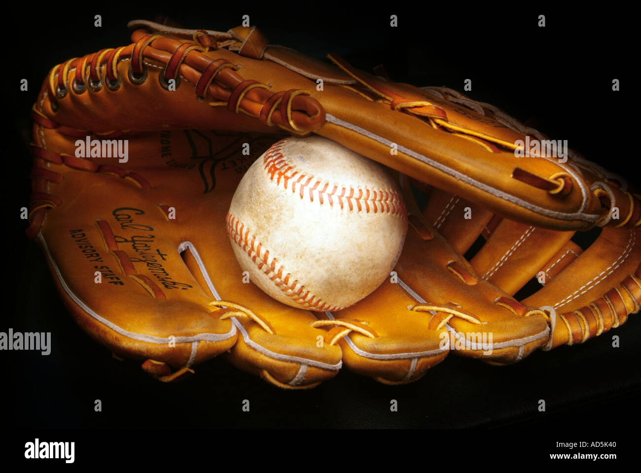 Baseball with baseball glove Stock Photo