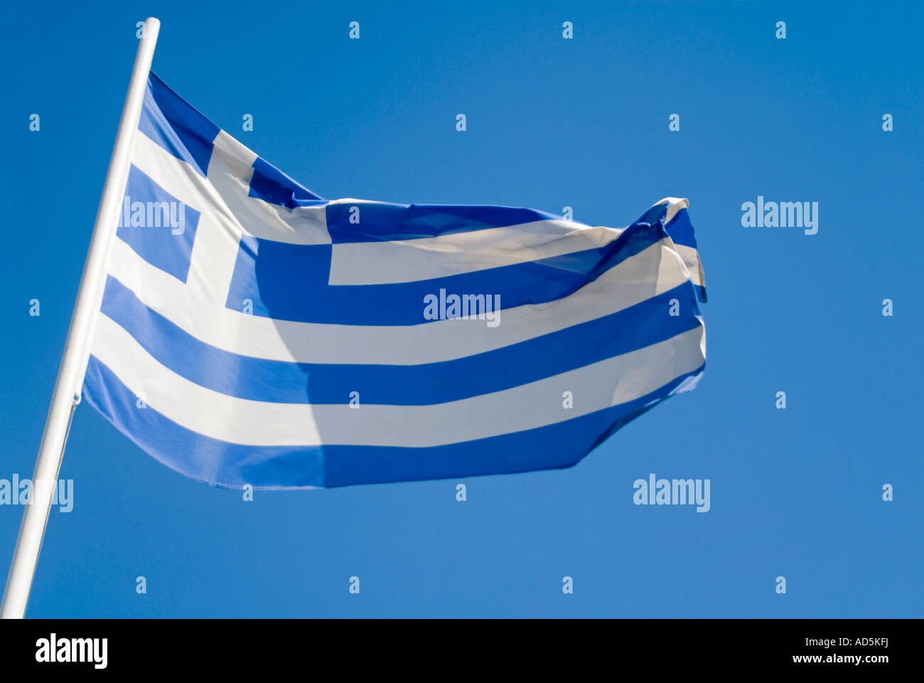 Horizontal close up of the blue and white striped Greek flag against a