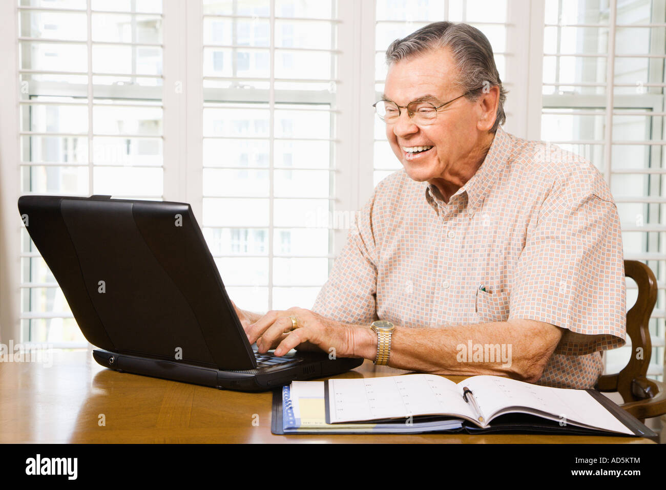 Mature adult man typing hi-res stock photography and images - Alamy