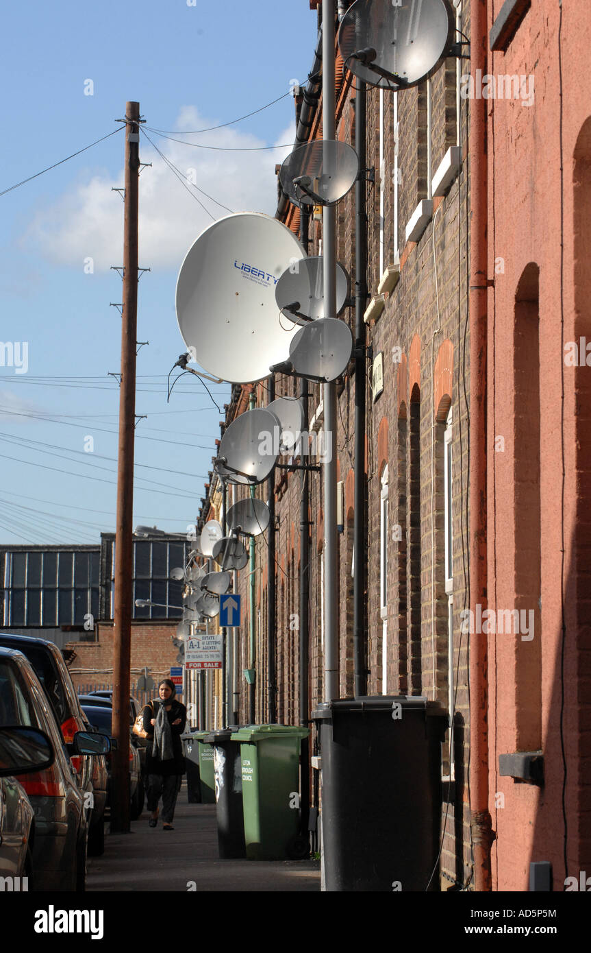 Terraced houses in Luton England covered with Satellite dishes April