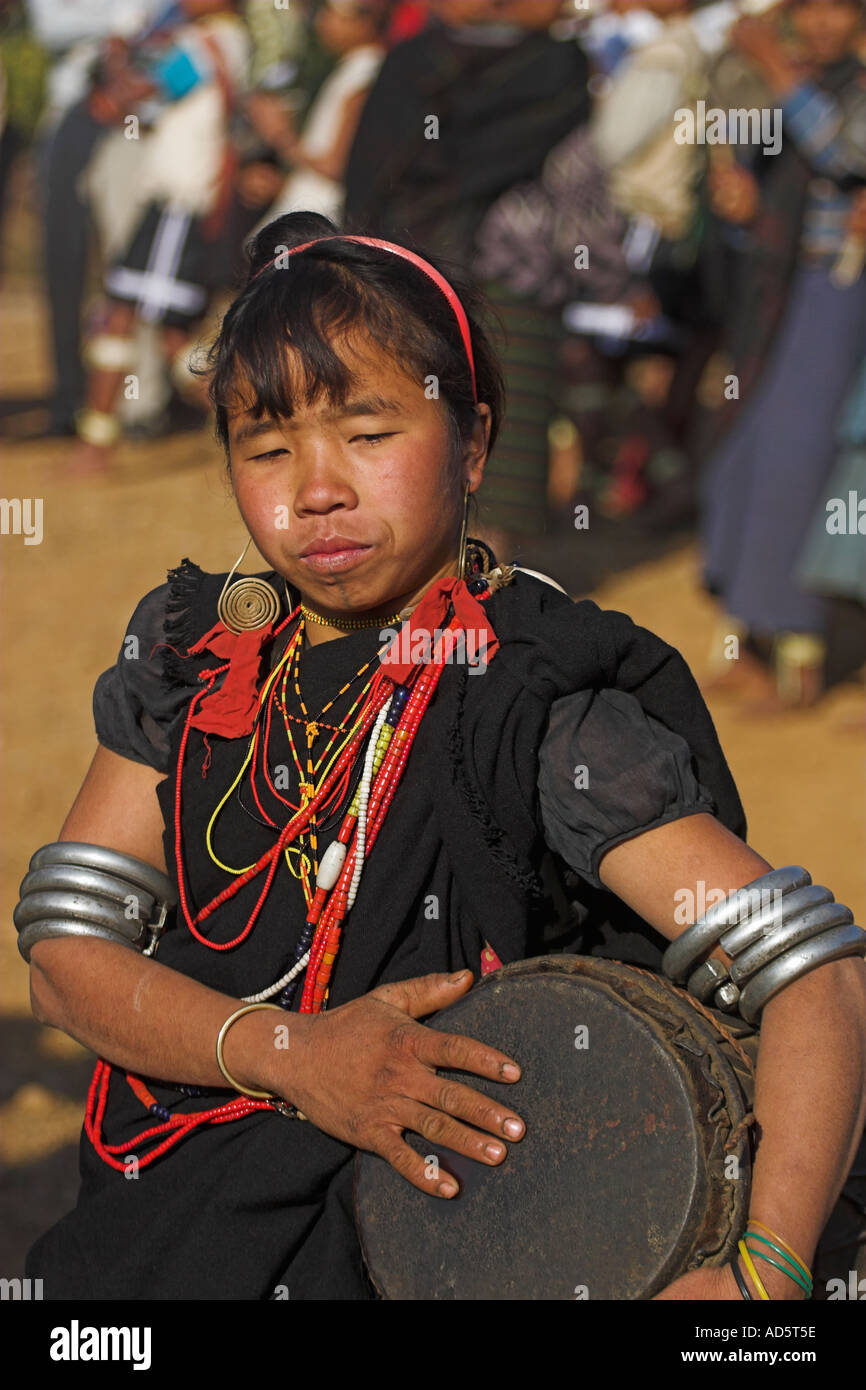 MYANMAR BURMA Sagaing Division Lahe village Naga New Year Festival Naga lady dancing and playing drum Stock Photo