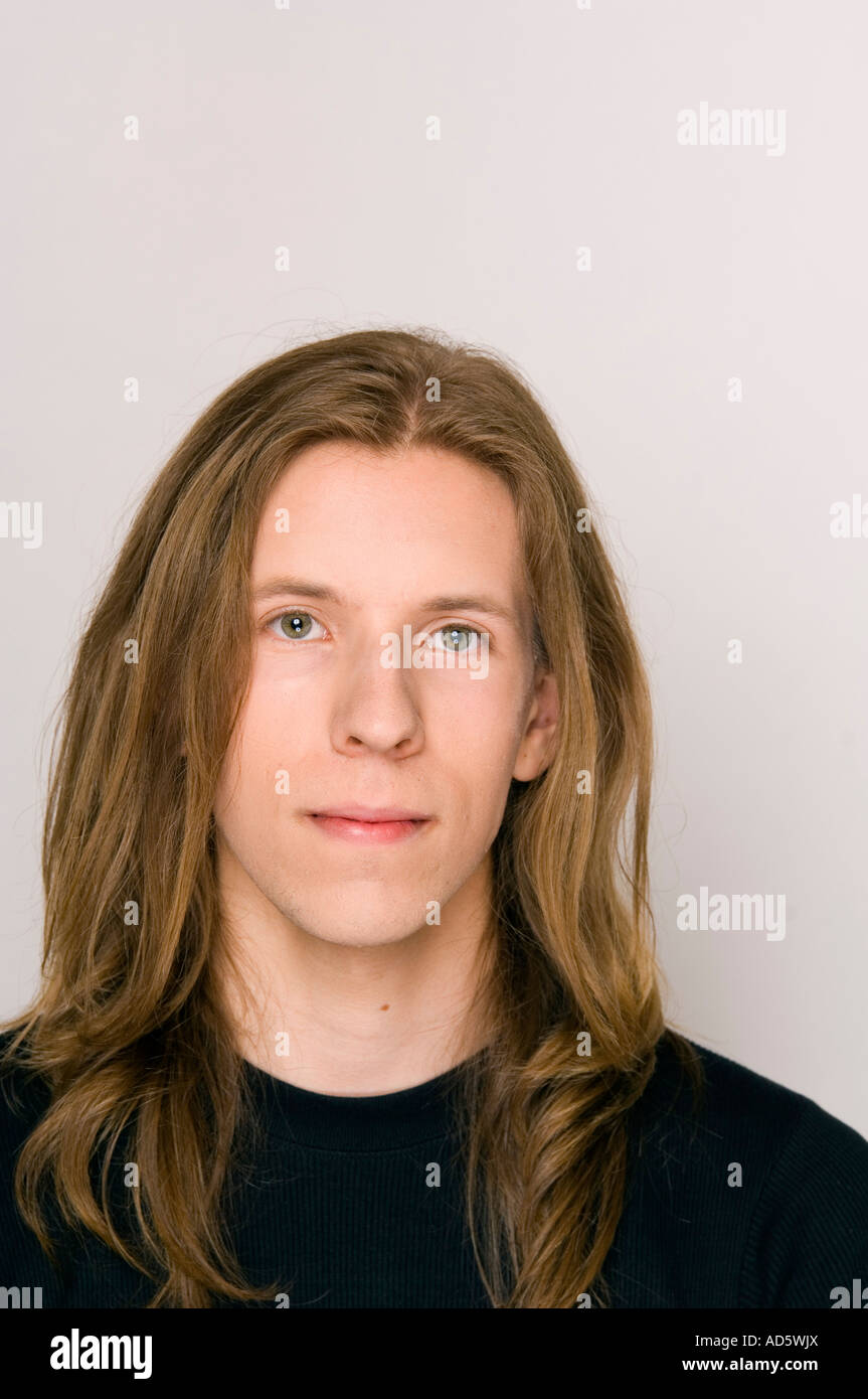 Portrait of young man with long hair Stock Photo - Alamy