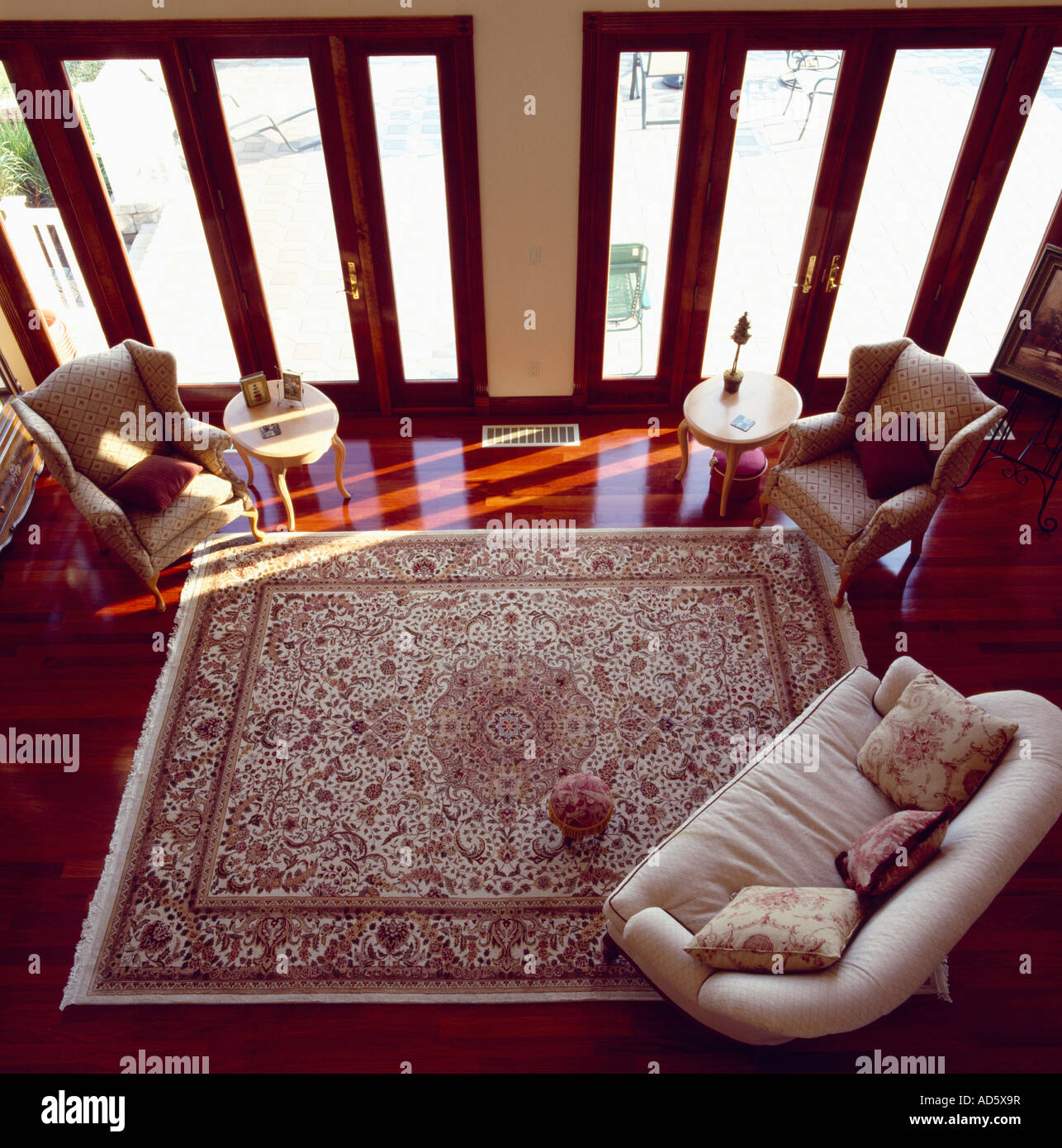 Birdseye view of living room with cream sofa and large patterned