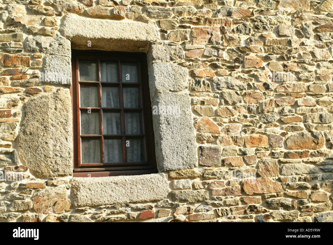 Stone house facade with window Stock Photo - Alamy