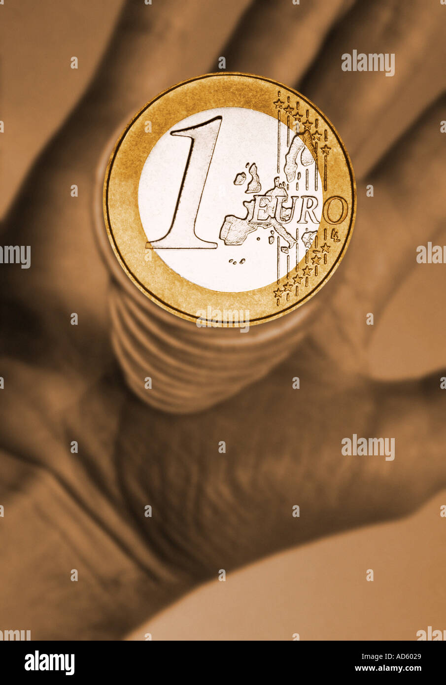 hand holding stack of Euro coins Stock Photo