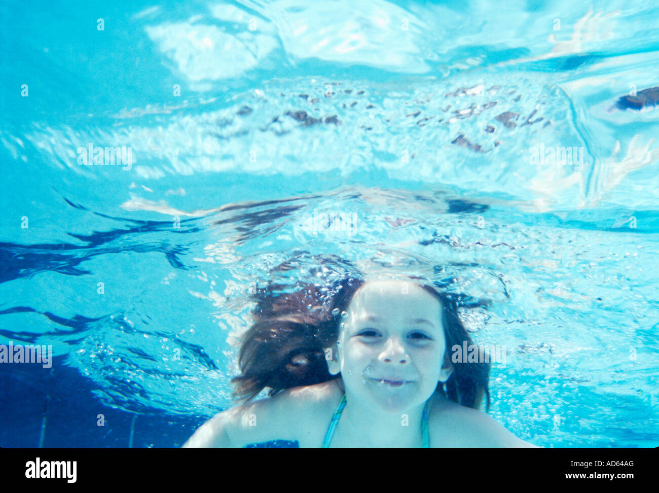 Young girl swimming under water Stock Photo Alamy