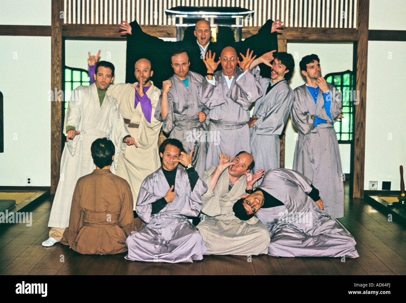 Group of men in robes at Zen monastery acting goofy Stock Photo