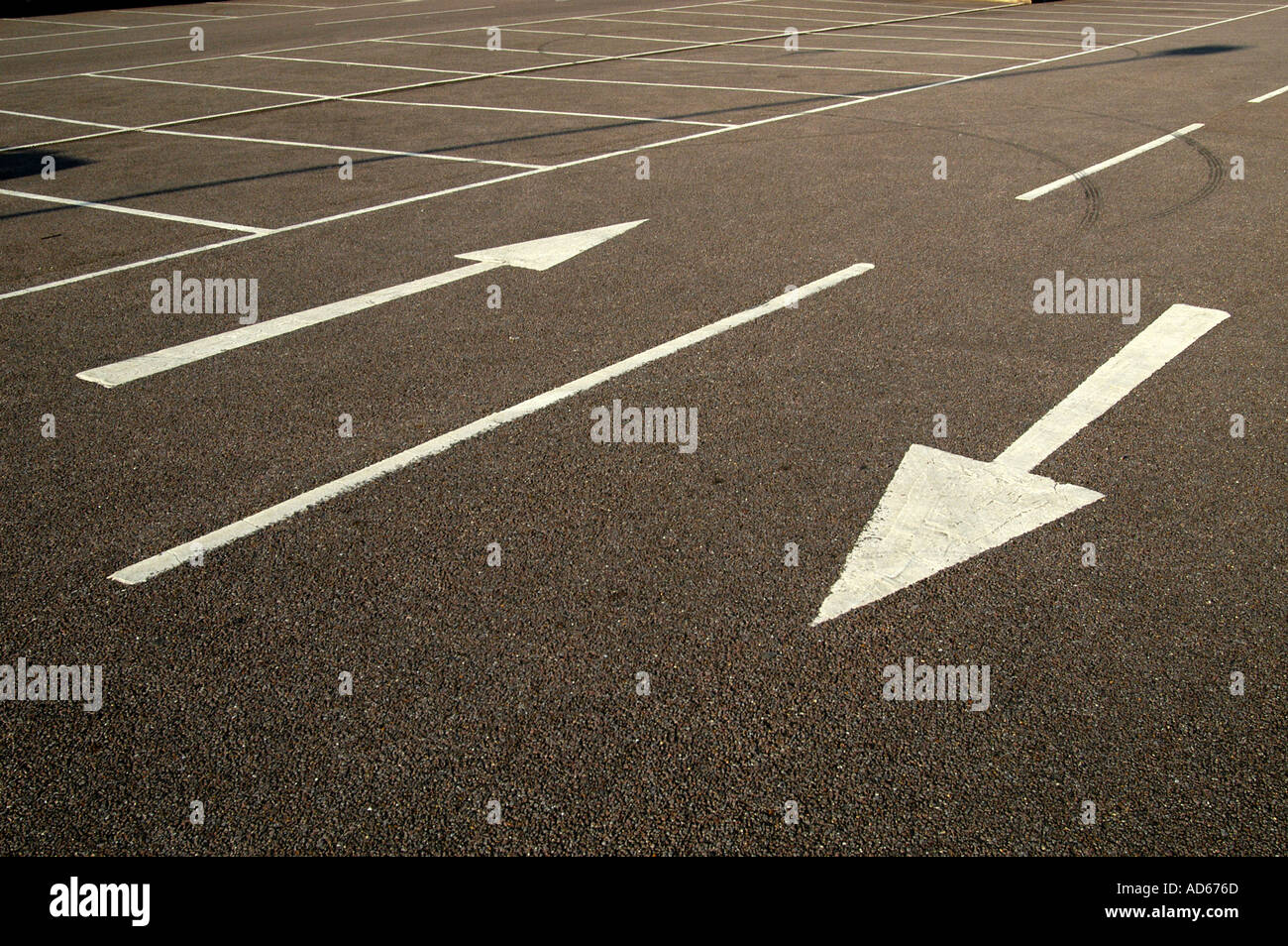 Arrows in empty car park Stock Photo