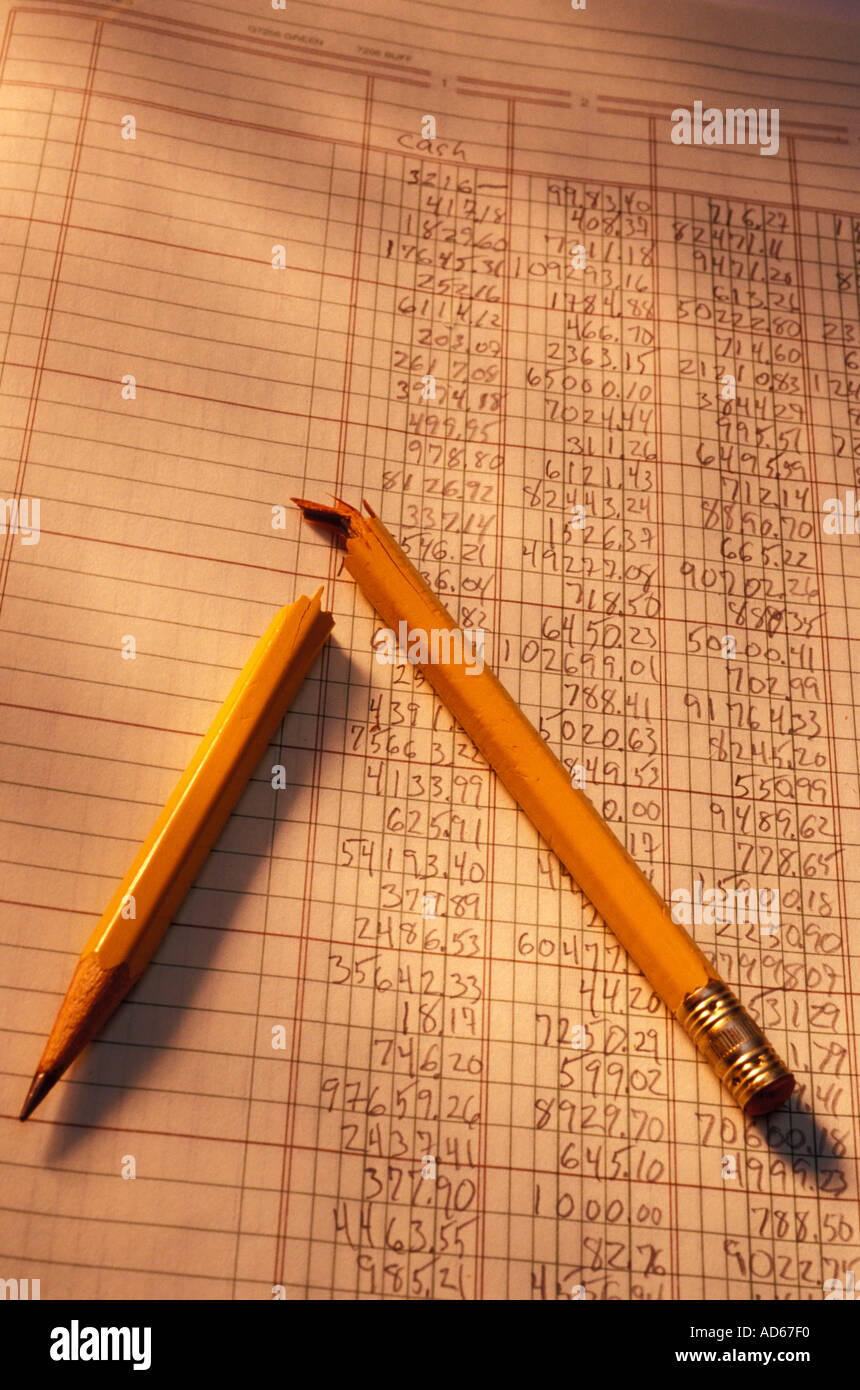 Broken pencil on accounting spread sheet Stock Photo