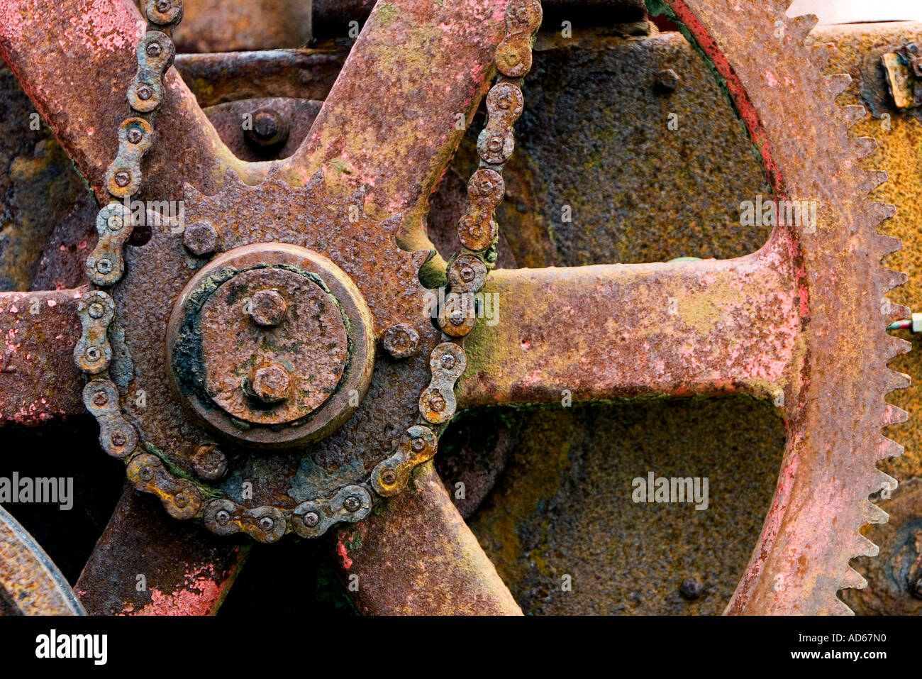 Old corroded chain driven farm machinery Stock Photo