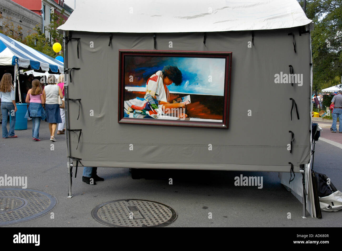 painting on display at art festival Stock Photo Alamy