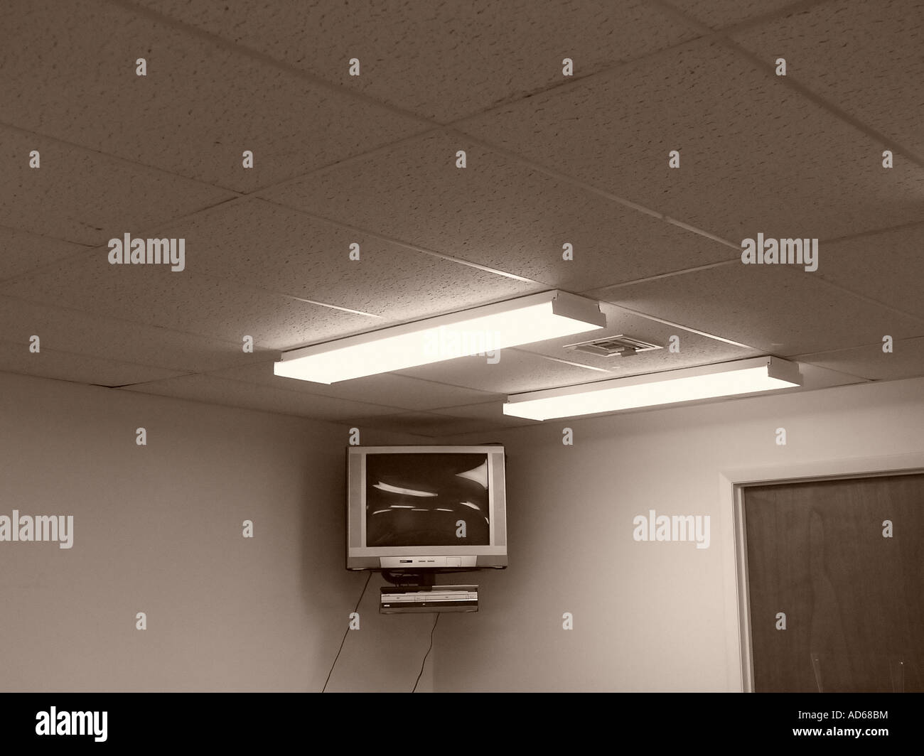 Television Suspended From Ceiling Of A Classroom Stock Photo