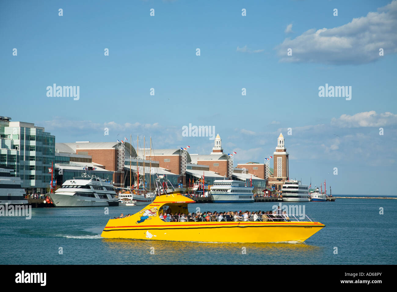 CHICAGO Illinois Yellow Seadog speedboat on Lake Michigan Navy Pier buildings waters of Lake Michigan Stock Photo