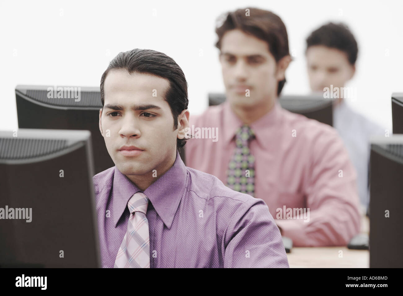 Business executives working on computers in an office Stock Photo
