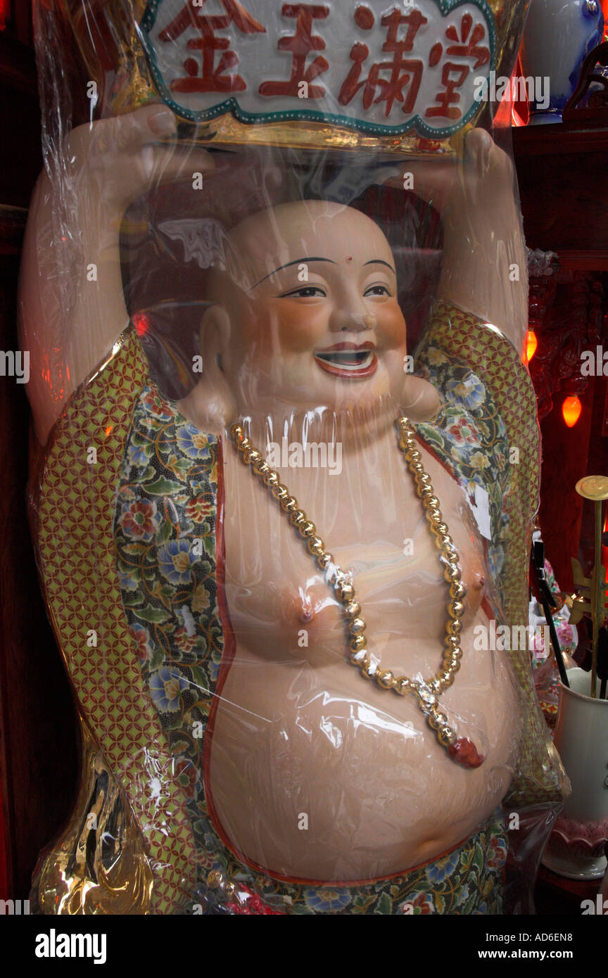 Vietnam Hanoi old quarter Budha figure wrapped in nylon for sale Stock Photo