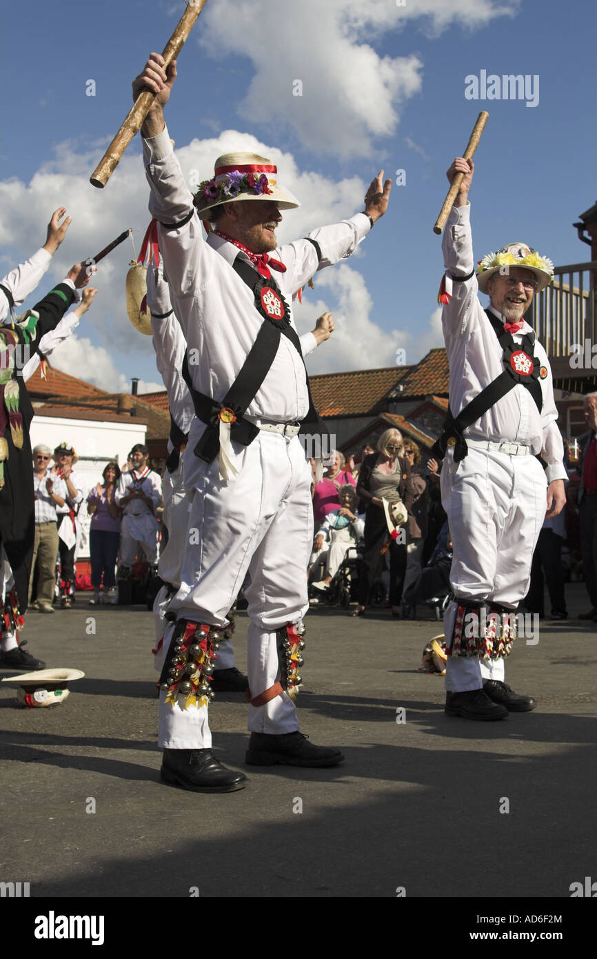 Morris dancers with floral hats performing a stick dance UK summer ...