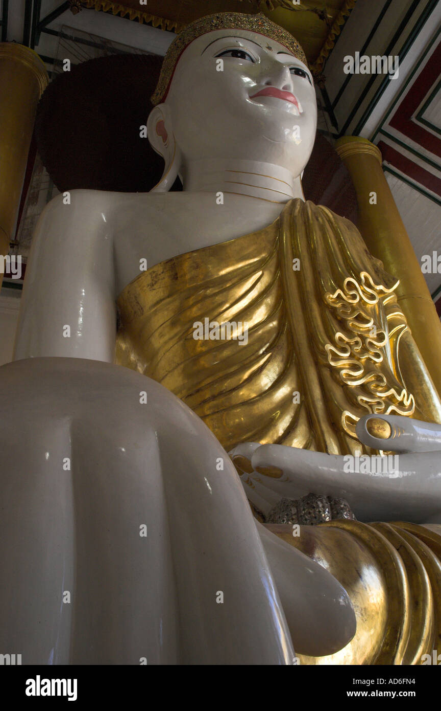 Myanmar Burma Yangon Shwedagon Paya close up of huge Budha figure Stock Photo