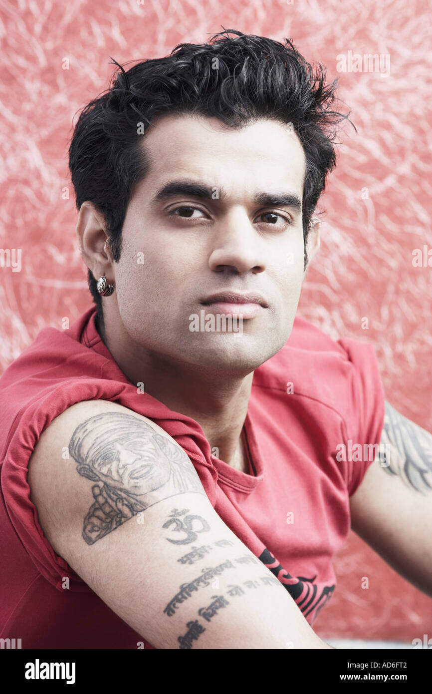 Young man with tattoos on arm hi-res stock photography and images - Alamy