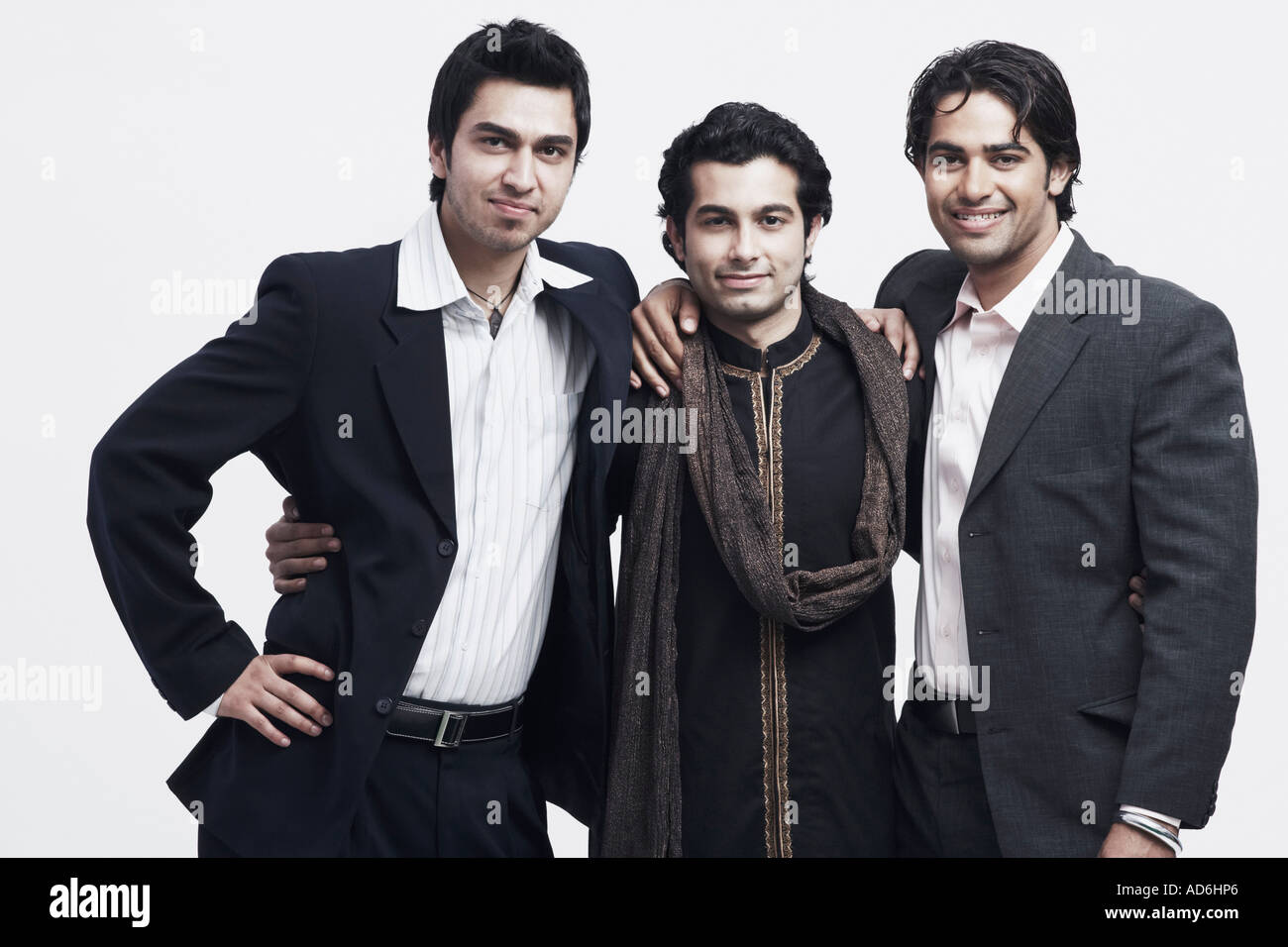 Three men with arms around each other hi-res stock photography and ...