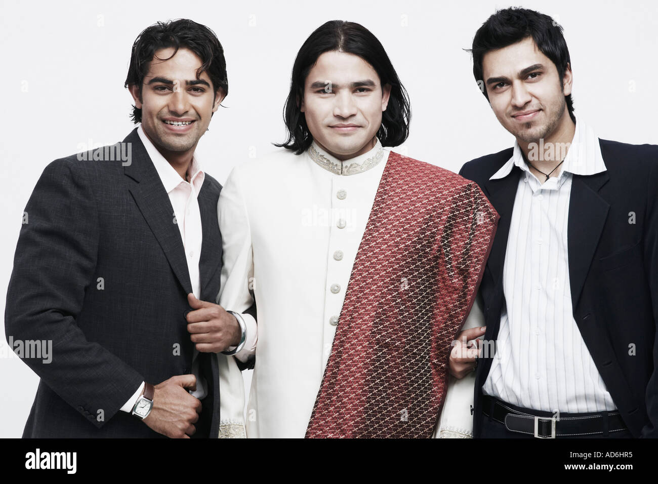Portrait of three young men smiling Stock Photo - Alamy