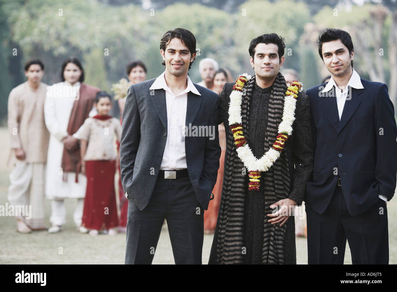 Portrait of three young men smiling Stock Photo - Alamy