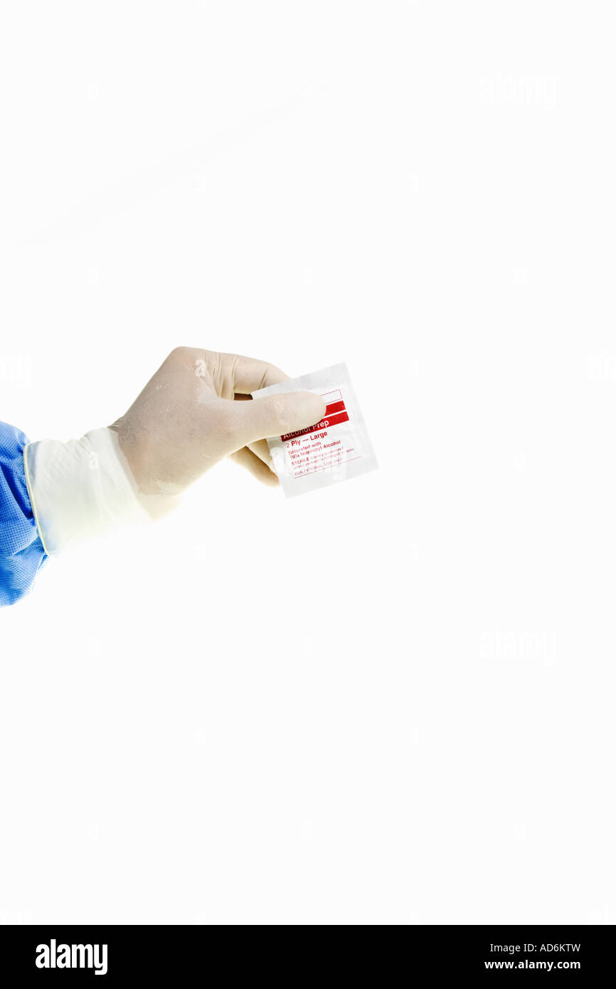Healthcare worker holding Alcohol prep pad Stock Photo