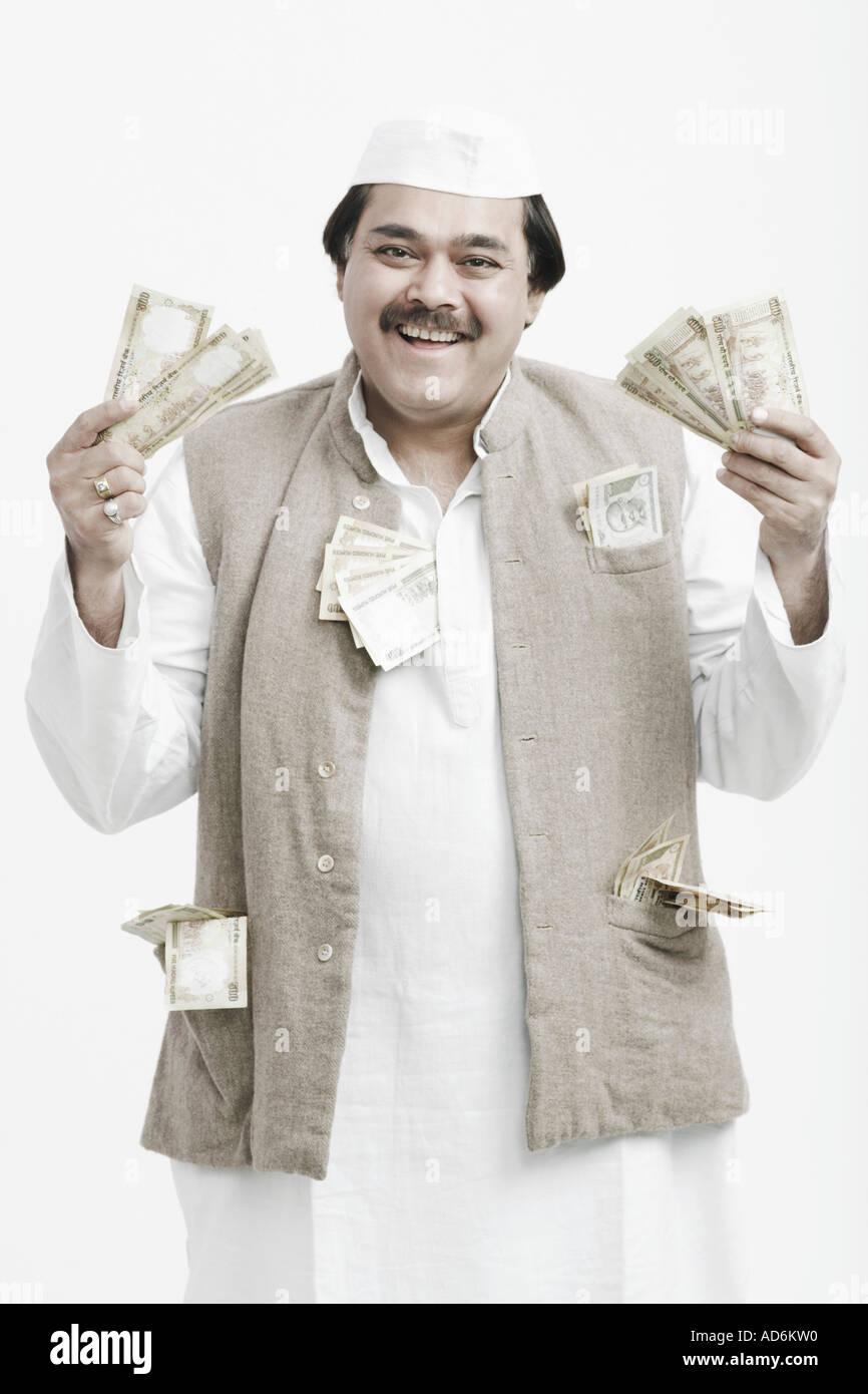 Portrait of a mature man holding Indian currency Stock Photo