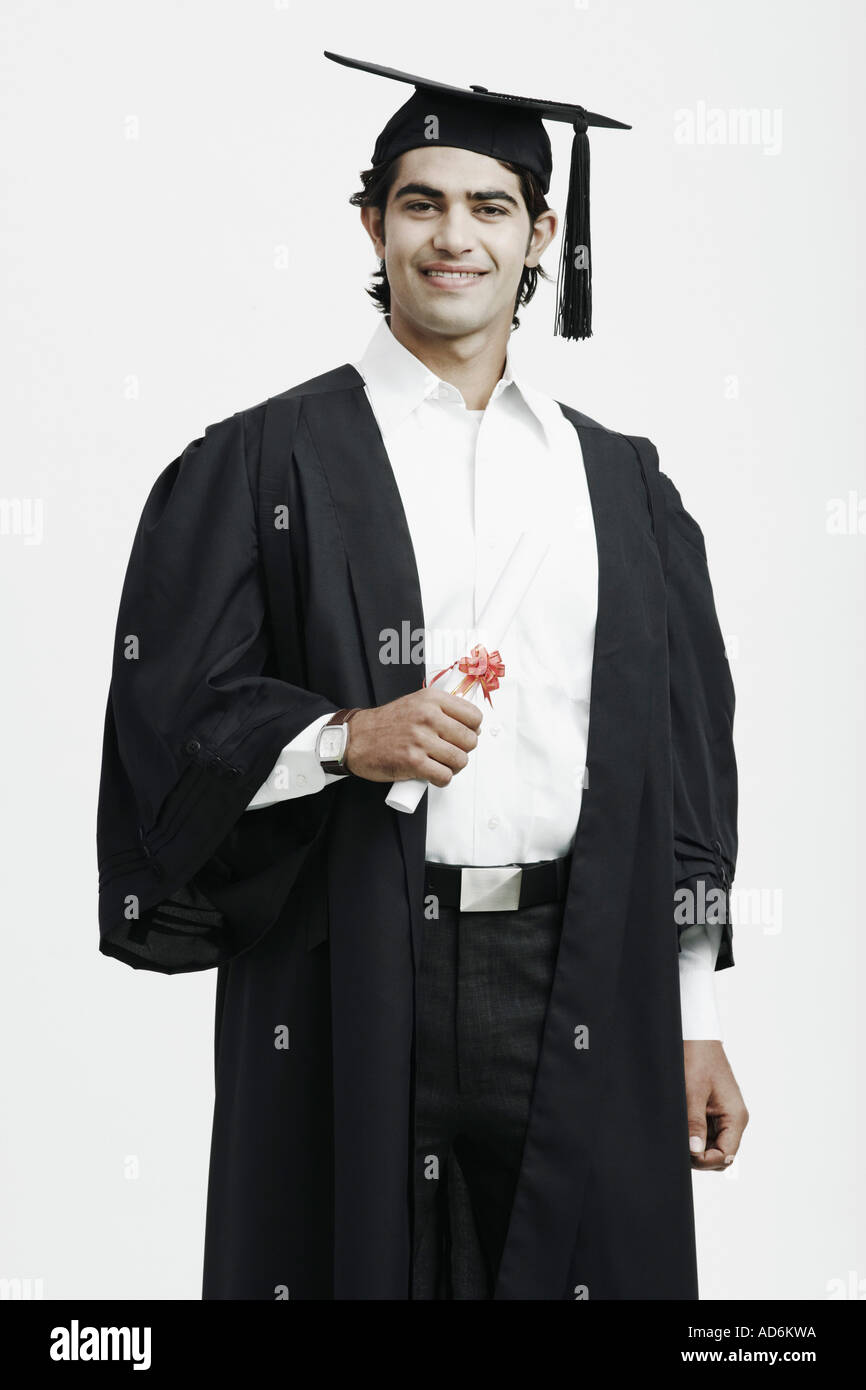 Portrait of a male graduate holding a diploma Stock Photo - Alamy