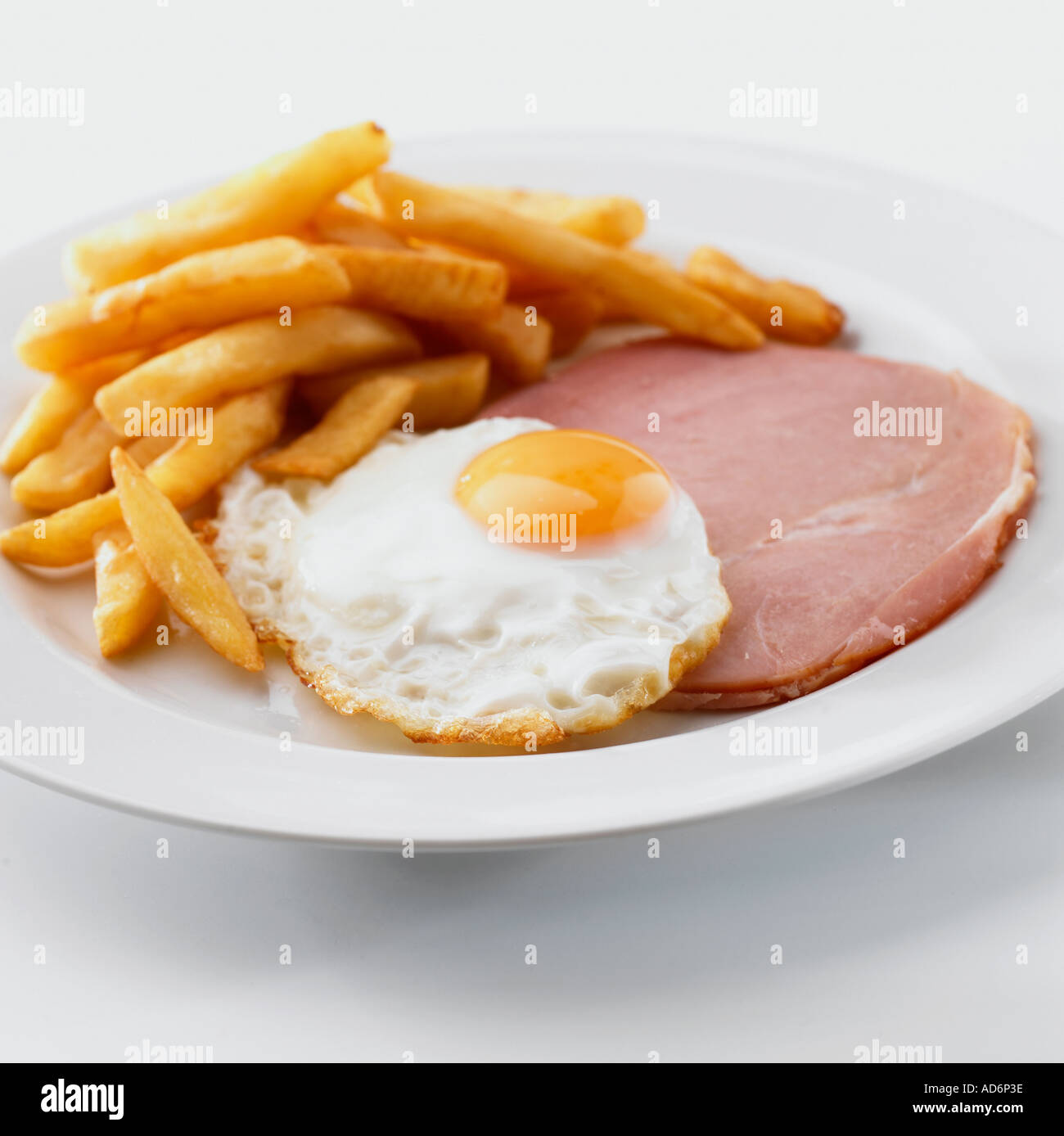 Ham fried egg and chips Keywords breakfast single plate portion Stock Photo