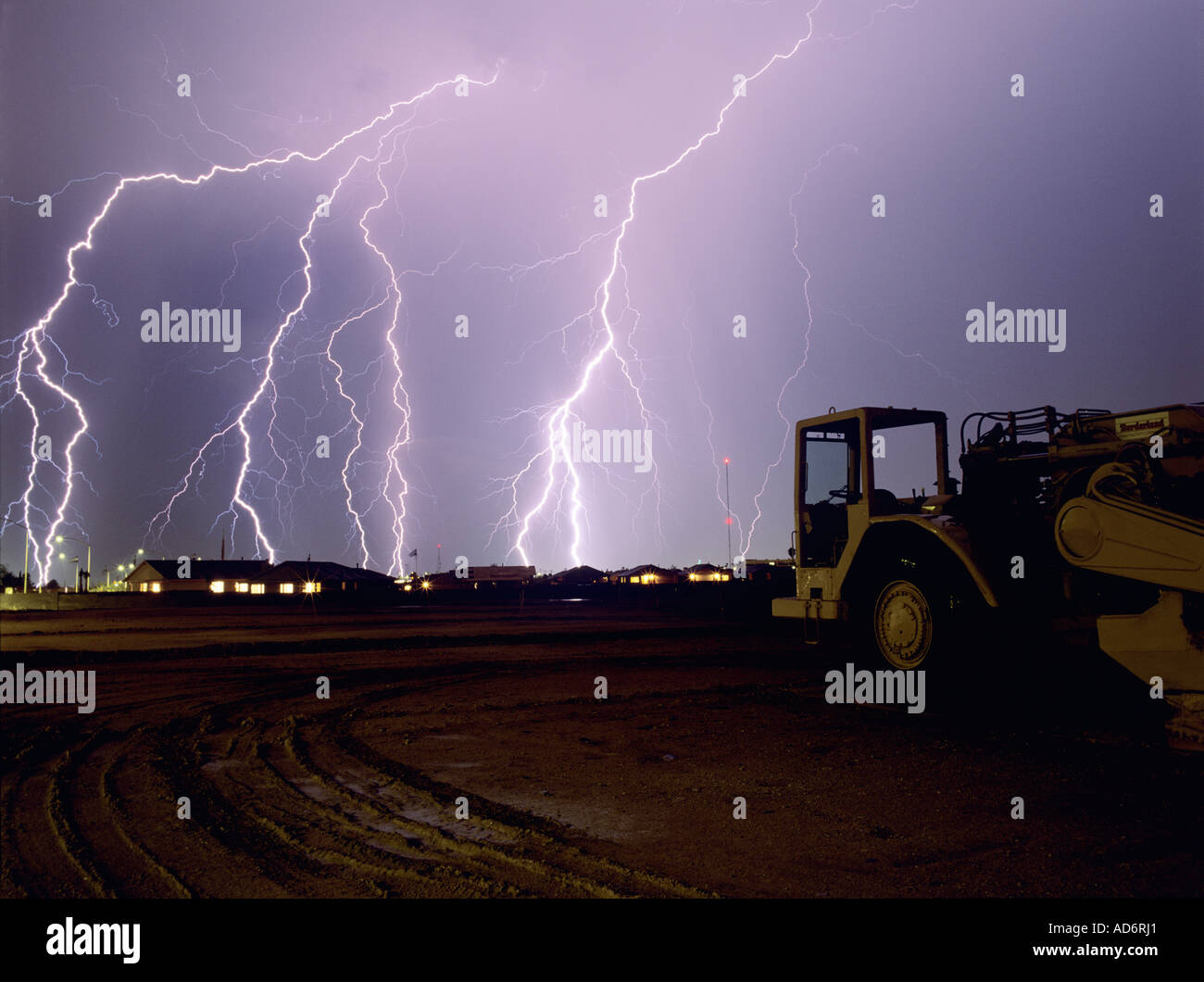 Multiple lightning strikes come down over a new construction site in Southern Arizona near Tucson. Stock Photo