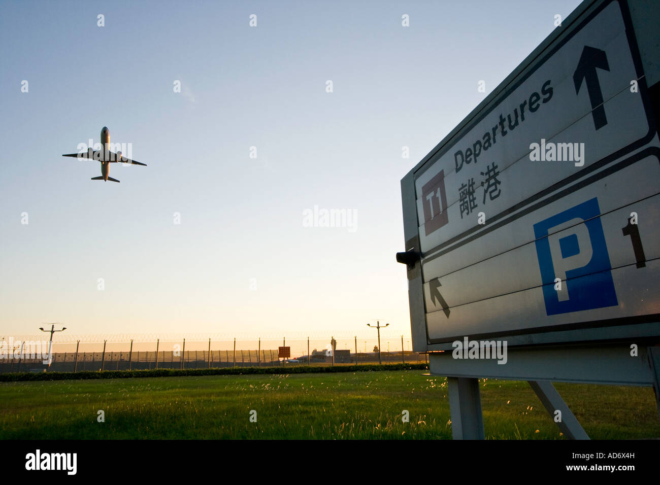 Departures Sign with Departing Plane Hong Kong International Airport HKG Stock Photo