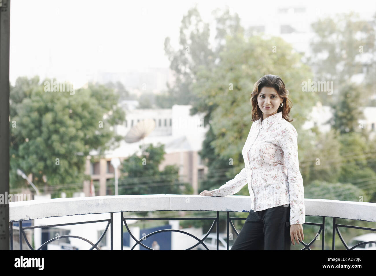 Indian woman standing in balcony hi-res stock photography and images ...