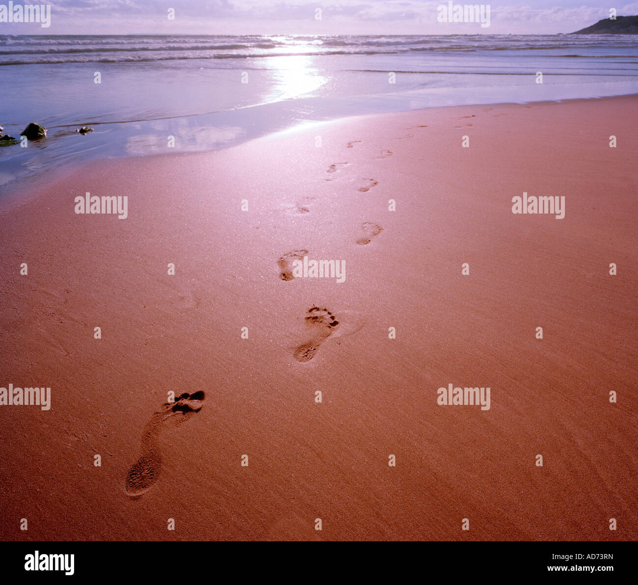 Footsteps on a deserted beach, North Devon, England, UK. Stock Photo