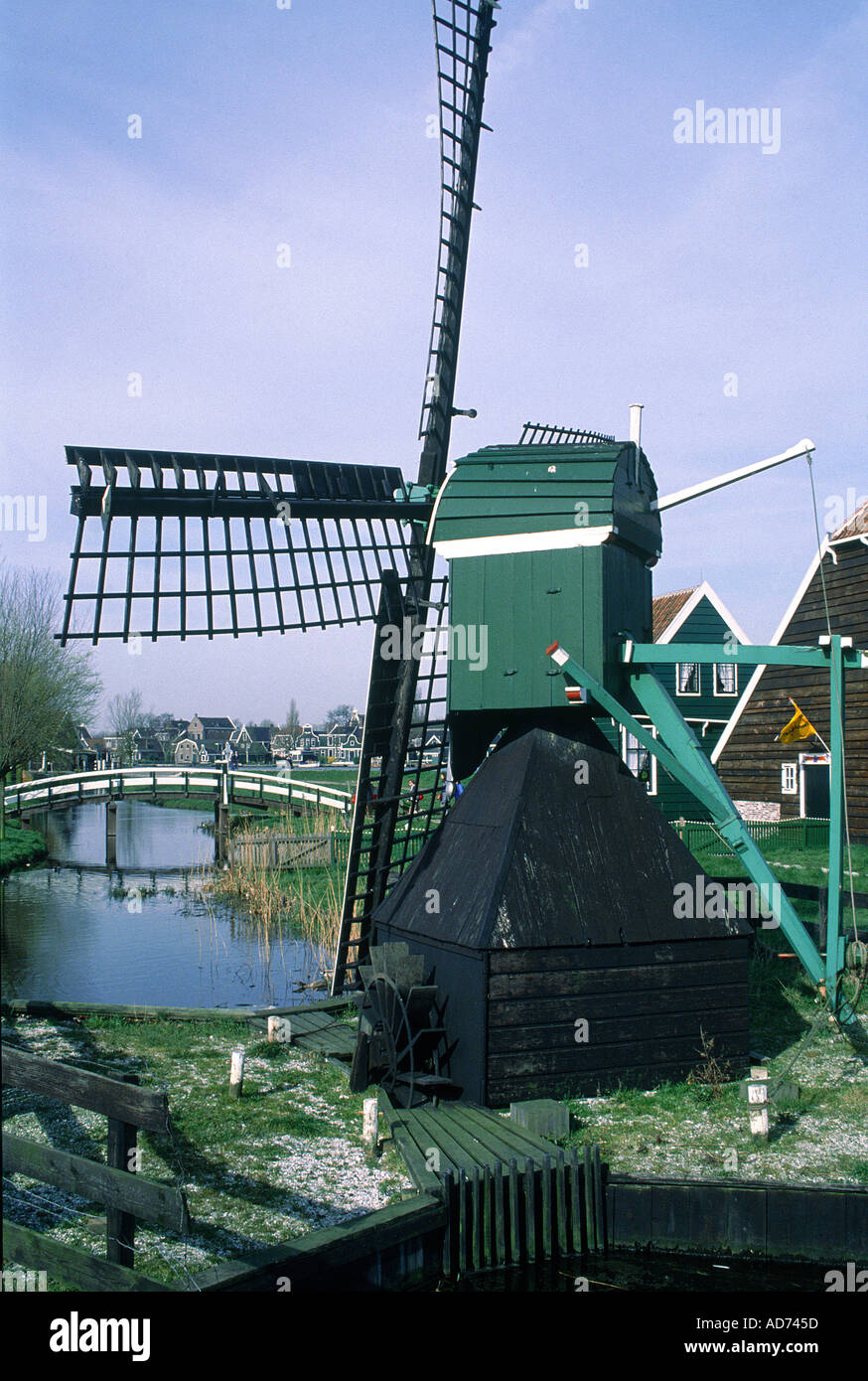 NETHERLANDS COUNTRY ZAANDAM ANCIENT WOODEN WINDMILLS AND CANAL Stock Photo