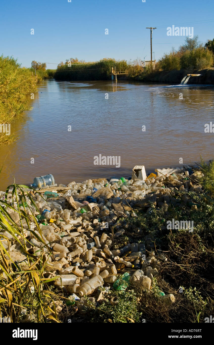Pile of Plastic bottle pollution floating in the Alamo River flowing