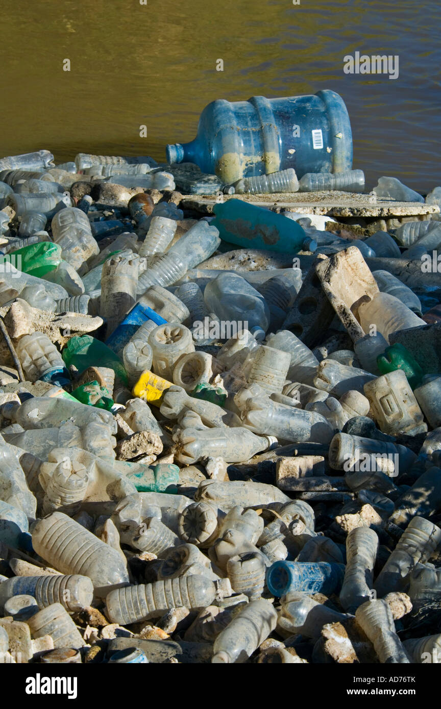 Pile of Plastic bottle pollution floating in the Alamo River flowing