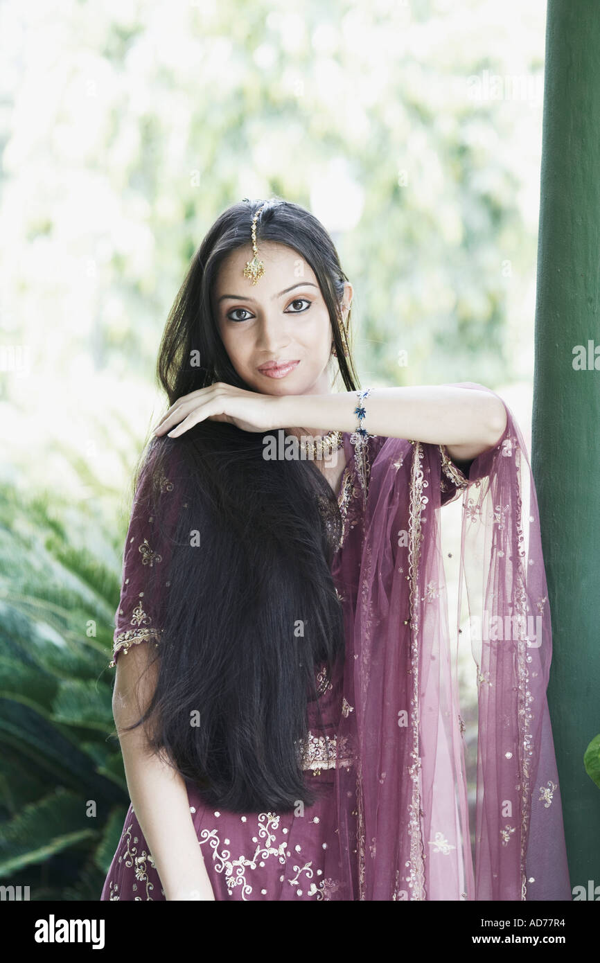 Free Photos - A Woman Can Be Seen Wearing Traditional Indian Clothing,  Possibly A Shawl, As She Poses For A Photo. The Woman Is Standing And  Facing The Camera, Making Her The