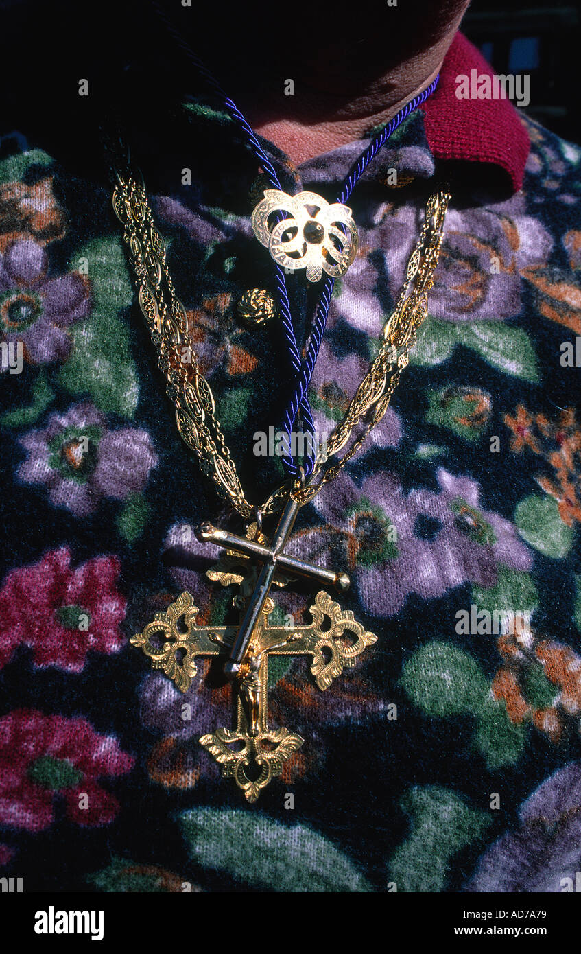 FRANCE ALPES SAVOIE MEGEVE TRADITIONAL GOLD CROSS WITH THE SUNDAY DRESS Stock Photo