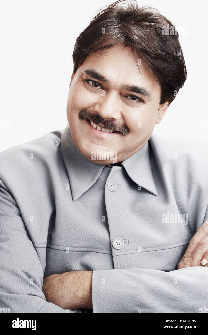 Portrait of a businessman with his arms crossed Stock Photo - Alamy