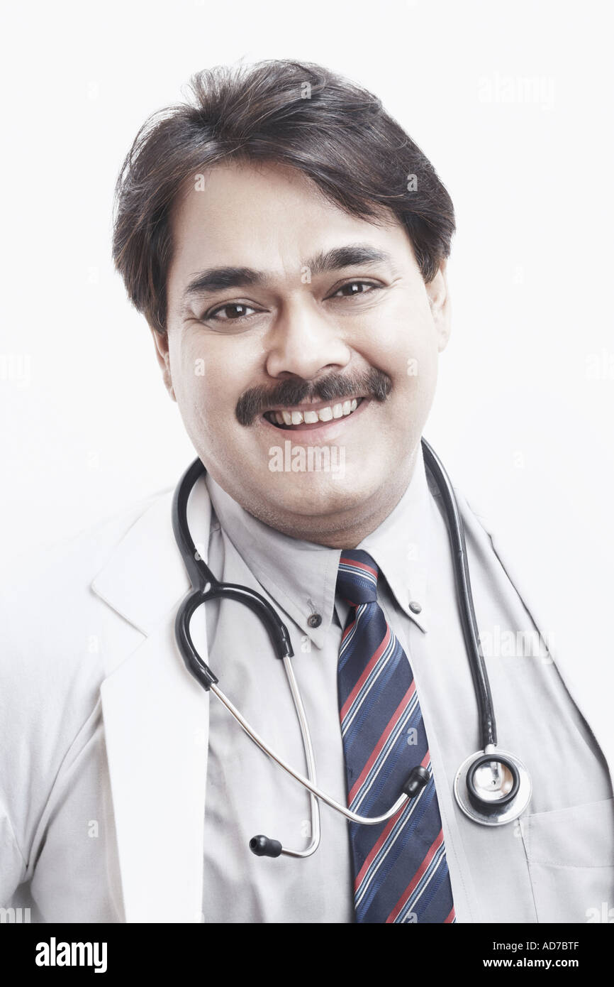 Portrait of a male doctor smiling Stock Photo - Alamy