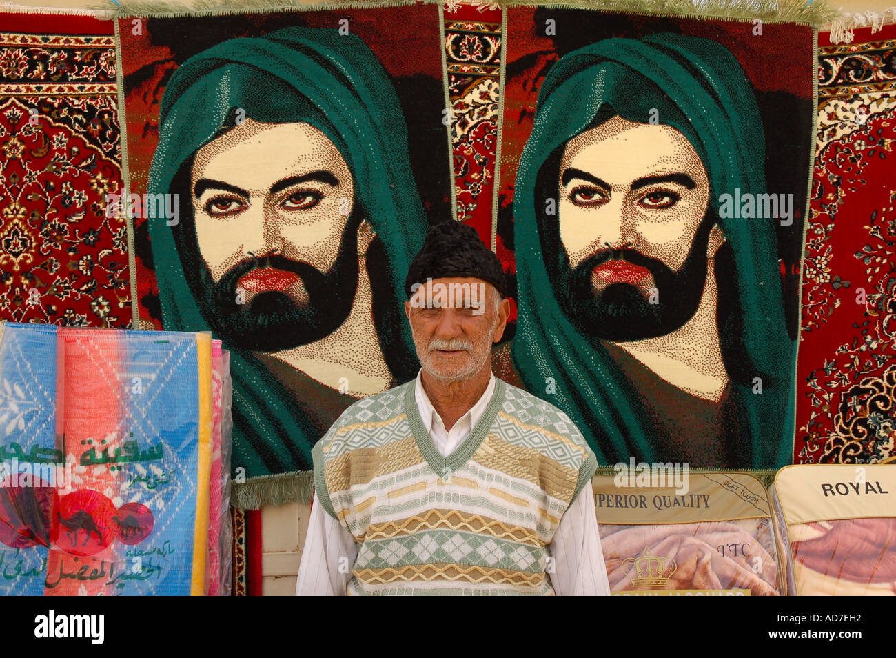 Old man selling Persian Rugs of Imam Ali in streets of Shahre Rey
