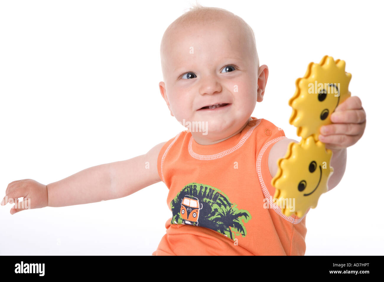 Sitting little boy with a toy Stock Photo - Alamy