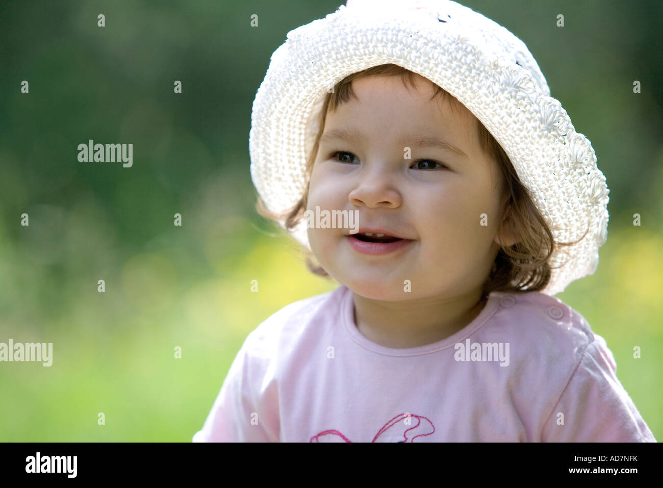 Portrait of little girl with a hat Stock Photo - Alamy