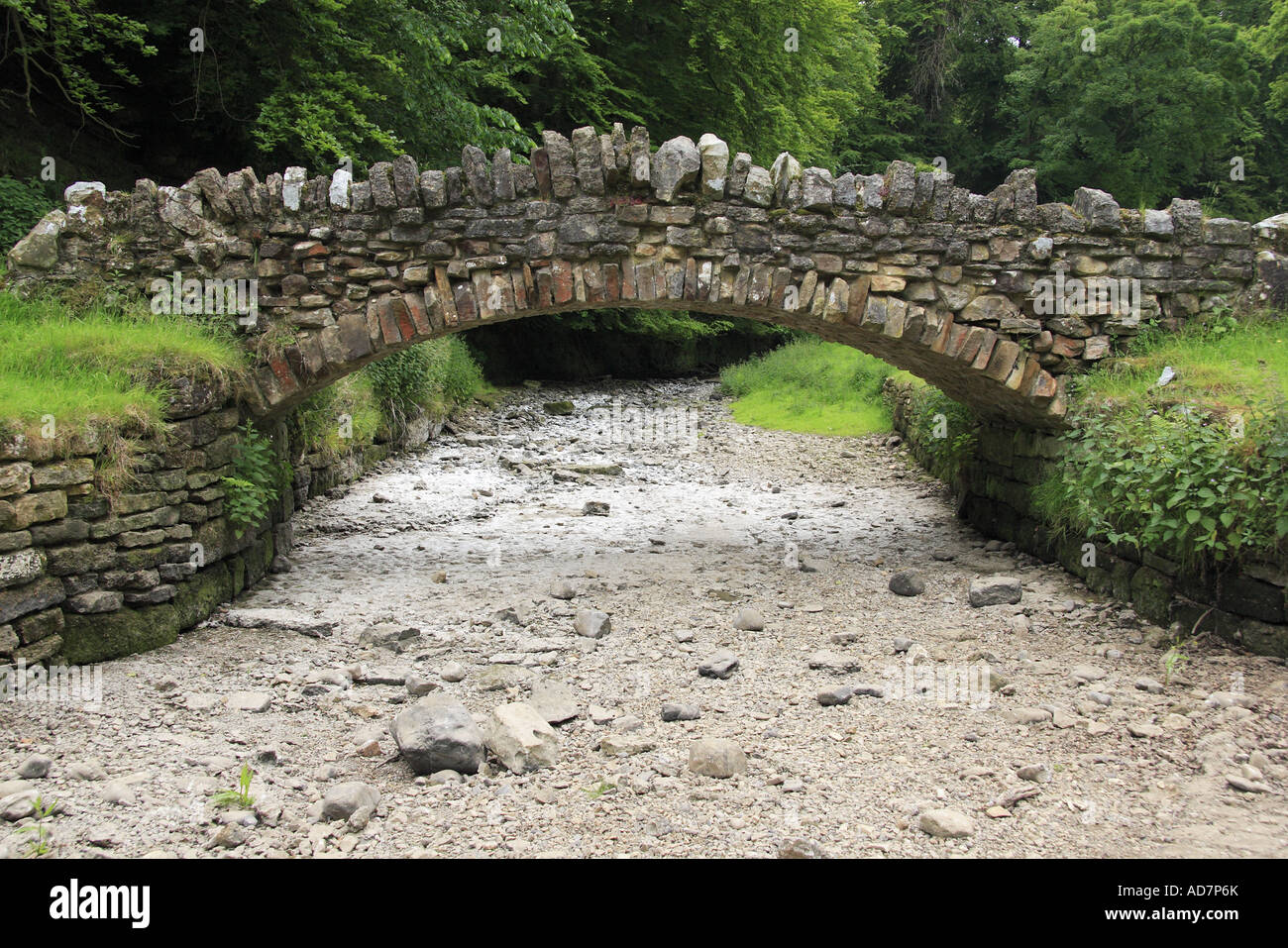Bridge over dry river bed, Studley Royal park, Yorkshire England Stock