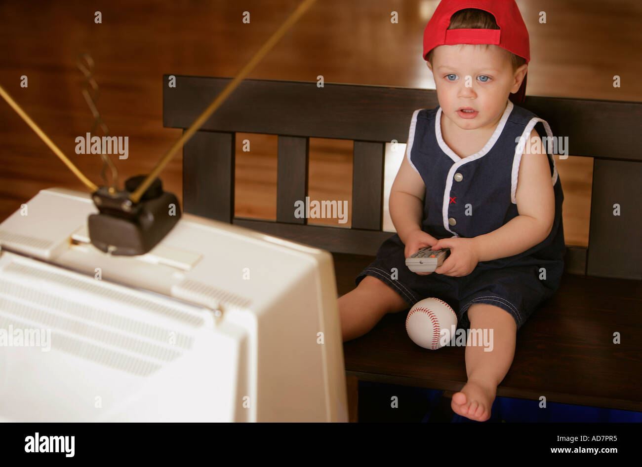 Child watching sports game on television Stock Photo Alamy