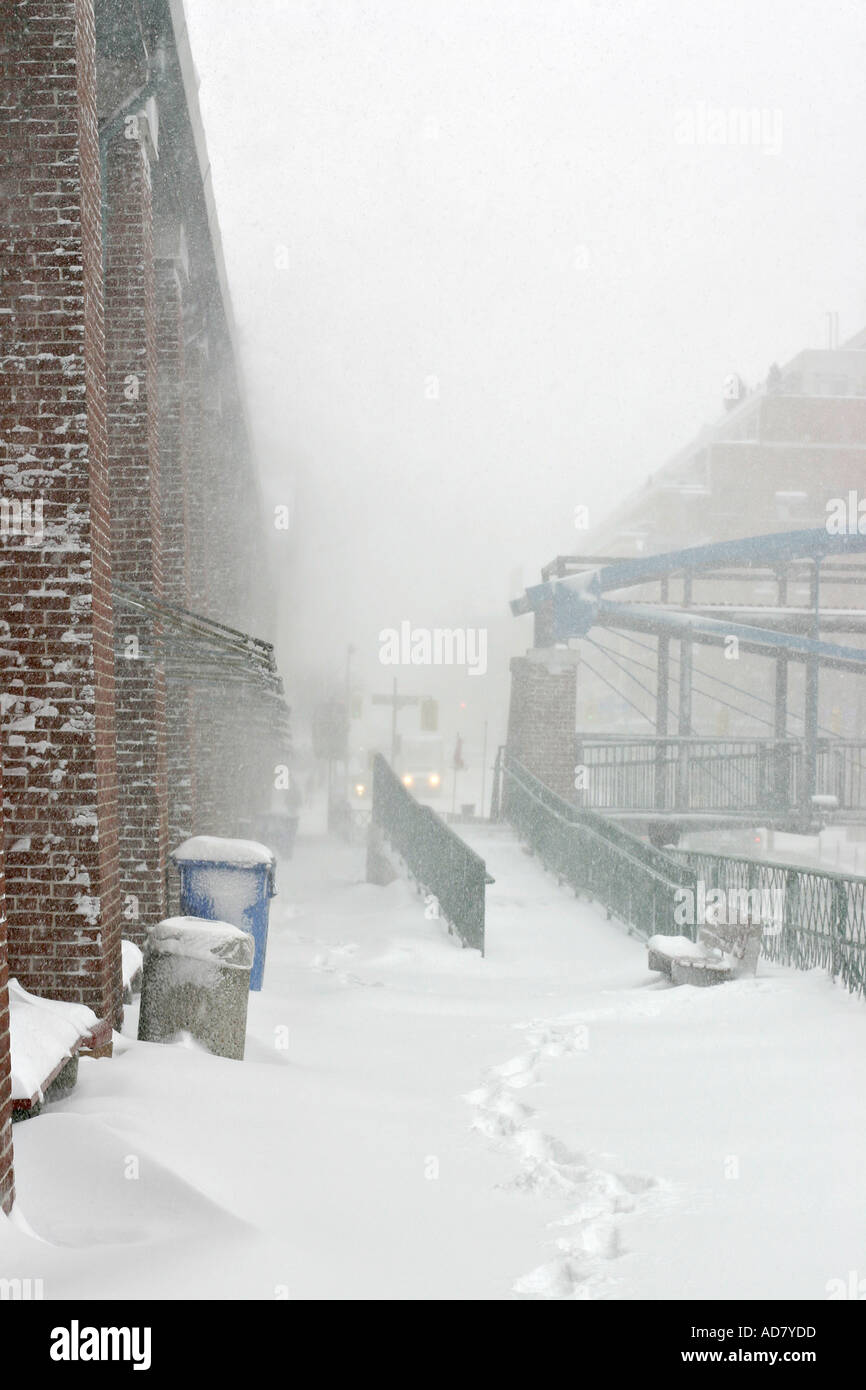 Snow blowing sticking to the brickwork of the market Behind is the near whiteout conditions of  Church Street looking North Stock Photo